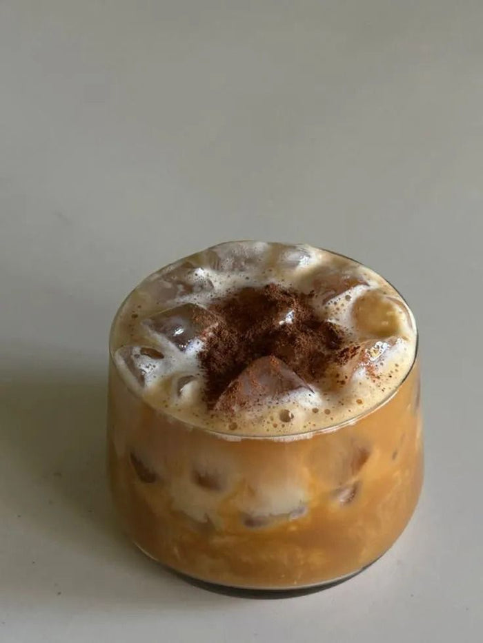 Iced salted honey latte in a short glass